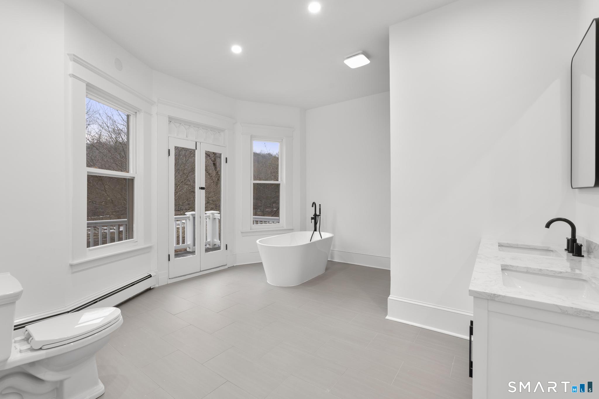 74 Cold Spring Street New Haven, CT 06511 - Photo 26 of 40 a bathroom with a toilet sink and shower