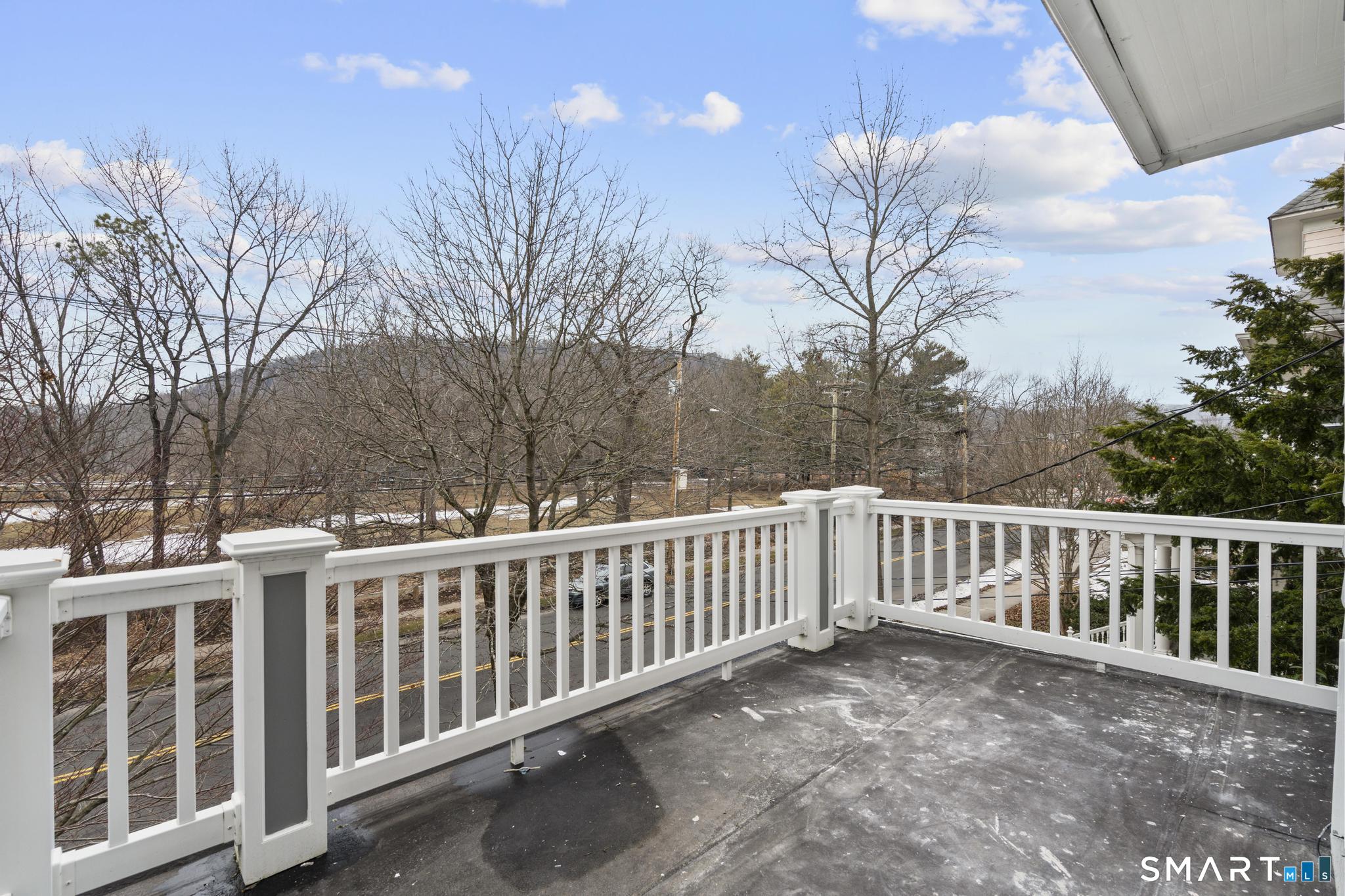 74 Cold Spring Street New Haven, CT 06511 - Photo 29 of 40 a view of a white house with a yard and wooden fence