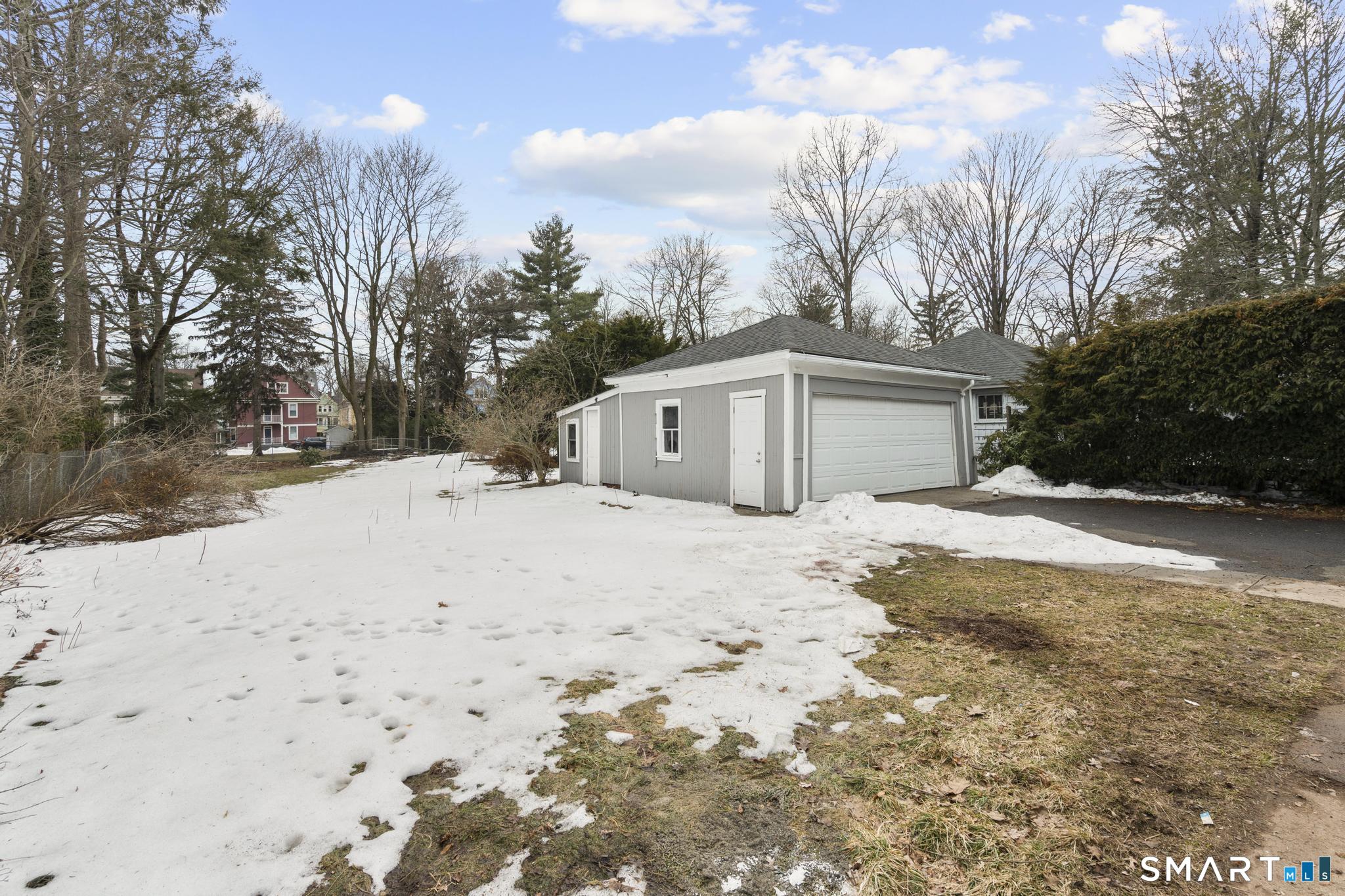 74 Cold Spring Street New Haven, CT 06511 - Photo 34 of 40 a view of white house with a yard covered in snow