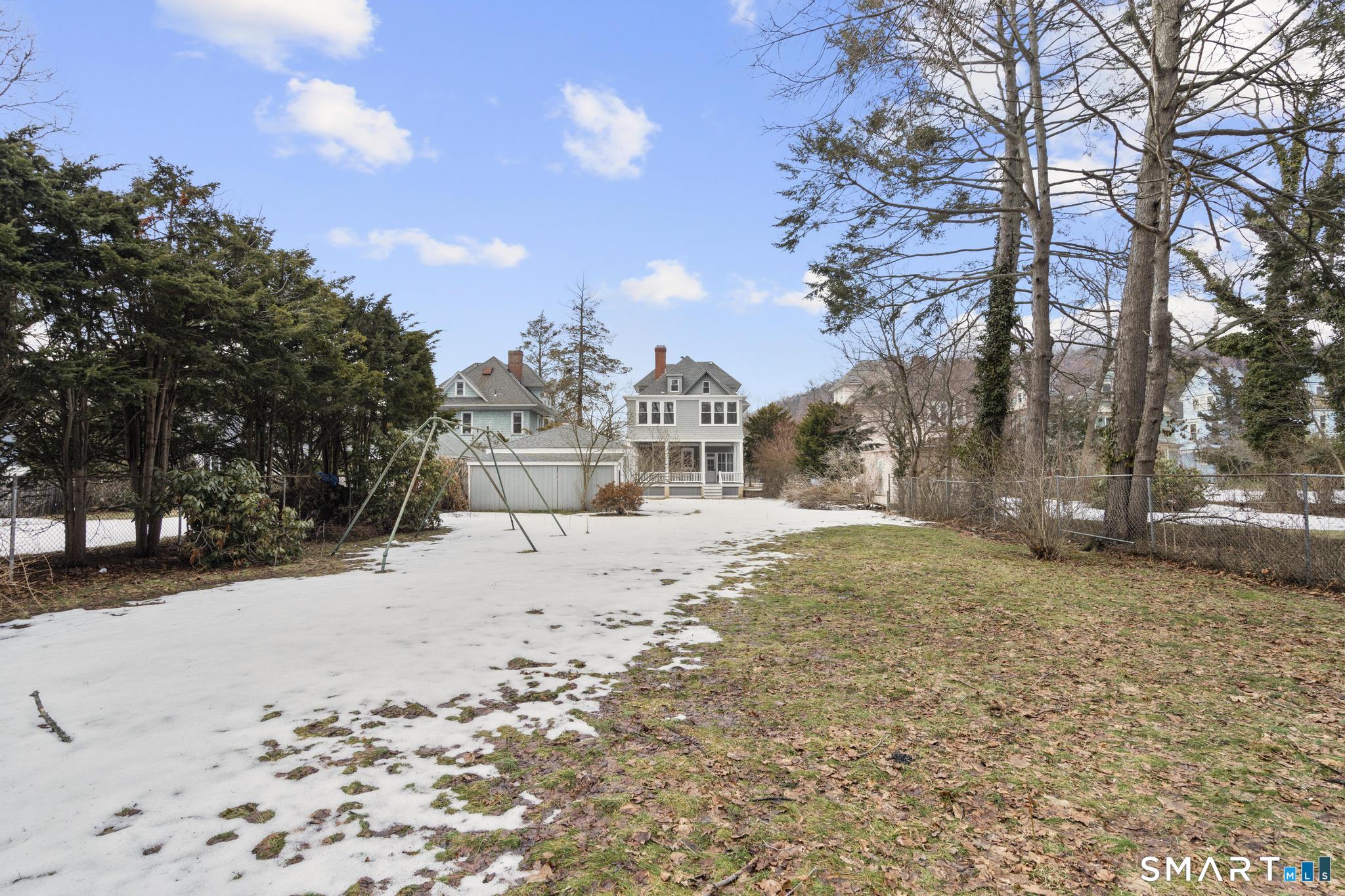 74 Cold Spring Street New Haven, CT 06511 - Photo 35 of 40 a front view of a house with a yard covered in snow