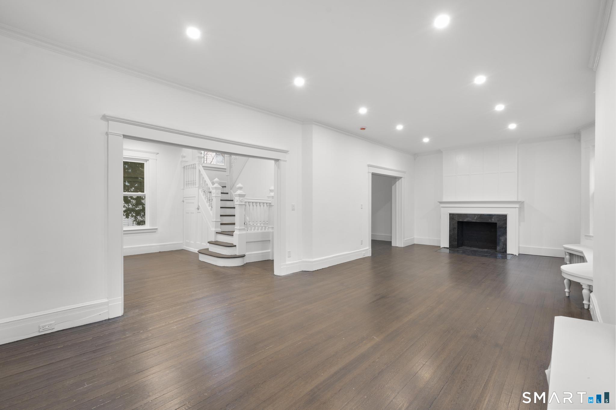 74 Cold Spring Street New Haven, CT 06511 - Photo 6 of 40 a view of an empty room with wooden floor and a window