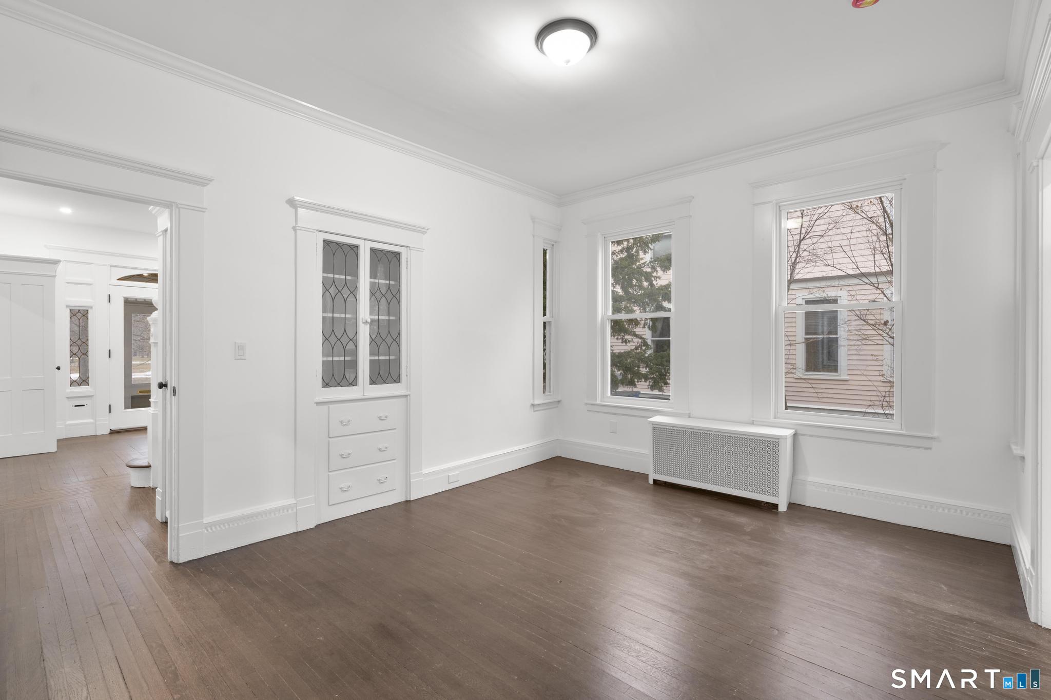74 Cold Spring Street New Haven, CT 06511 - Photo 8 of 40 an empty room with wooden floor and windows