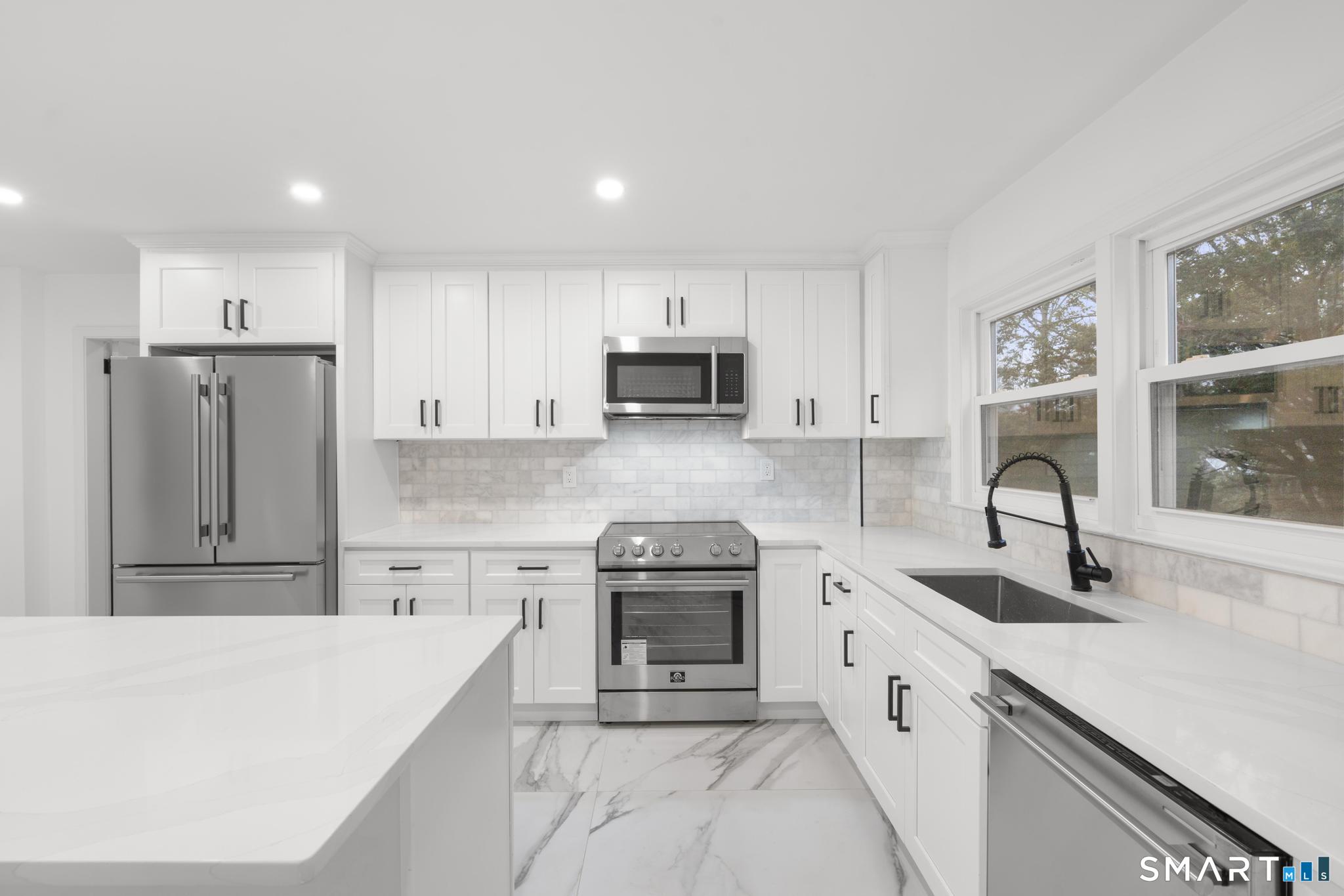 74 Cold Spring Street New Haven, CT 06511 - Photo 10 of 40 a kitchen with granite countertop a sink stove and refrigerator