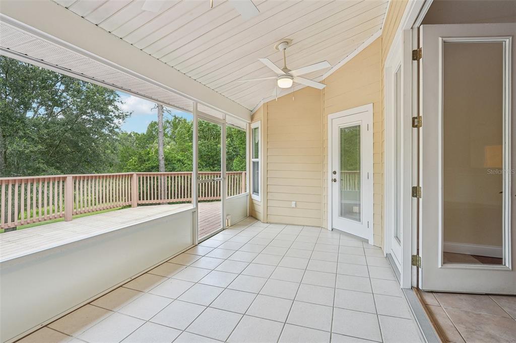 2342 Robert D Road Mount Dora, FL 32757 - Photo 14 of 44 an empty room with windows and ceiling fan