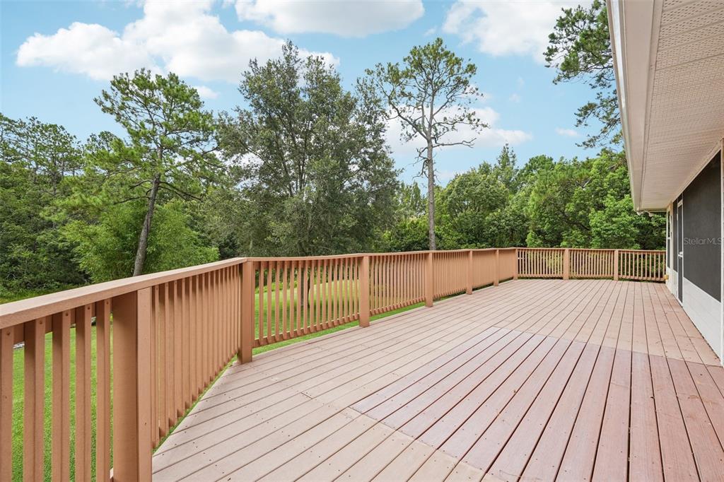 2342 Robert D Road Mount Dora, FL 32757 - Photo 16 of 44 a balcony with wooden floor and fence