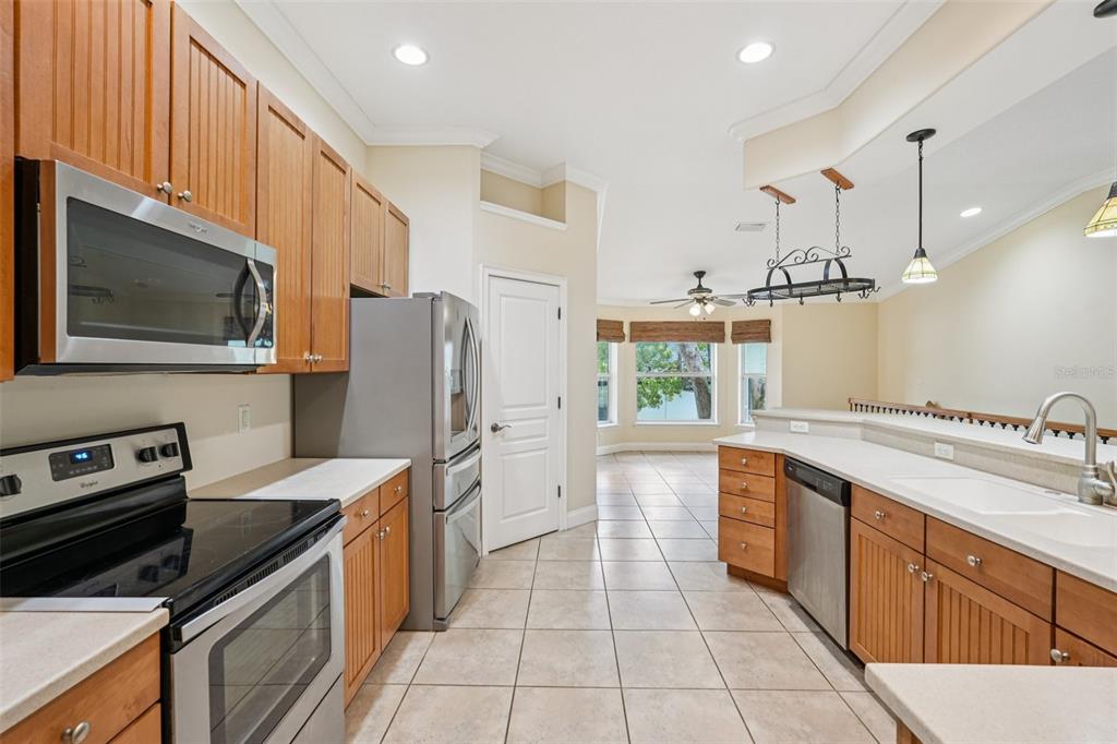 2342 Robert D Road Mount Dora, FL 32757 - Photo 22 of 44 a kitchen with a sink stove and refrigerator