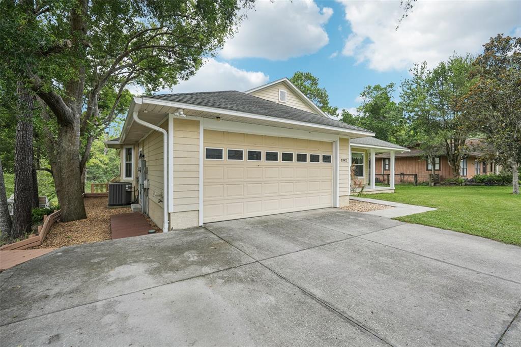 2342 Robert D Road Mount Dora, FL 32757 - Photo 3 of 44 front view of a house with a yard