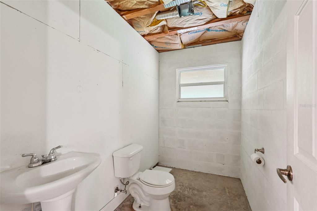 2342 Robert D Road Mount Dora, FL 32757 - Photo 38 of 44 a bathroom with a sink a toilet and shower