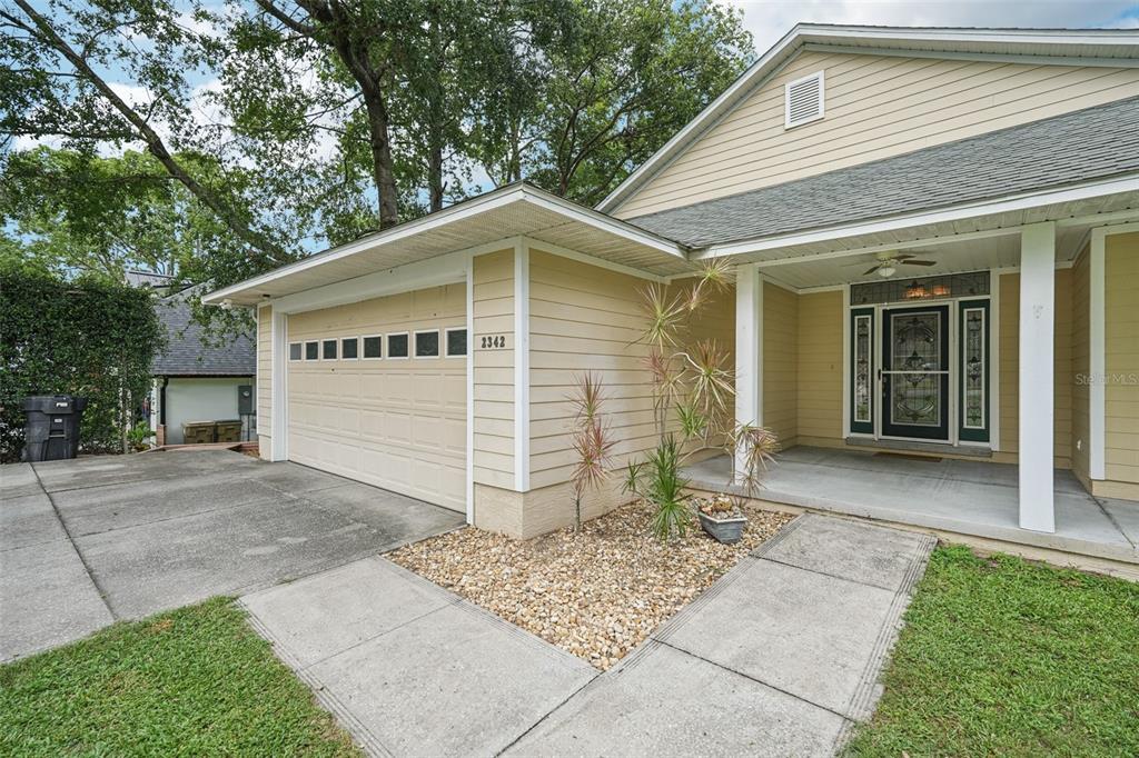 2342 Robert D Road Mount Dora, FL 32757 - Photo 4 of 44 a front view of a house with garden