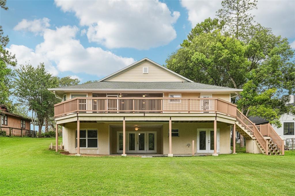 2342 Robert D Road Mount Dora, FL 32757 - Photo 5 of 44 a front view of a house with a yard