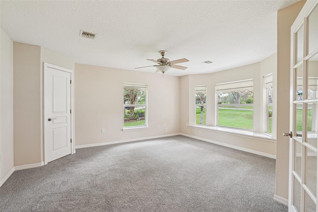 2342 Robert D Road Mount Dora, FL 32757 - Photo 9 of 44 a view of a livingroom with a ceiling fan and window