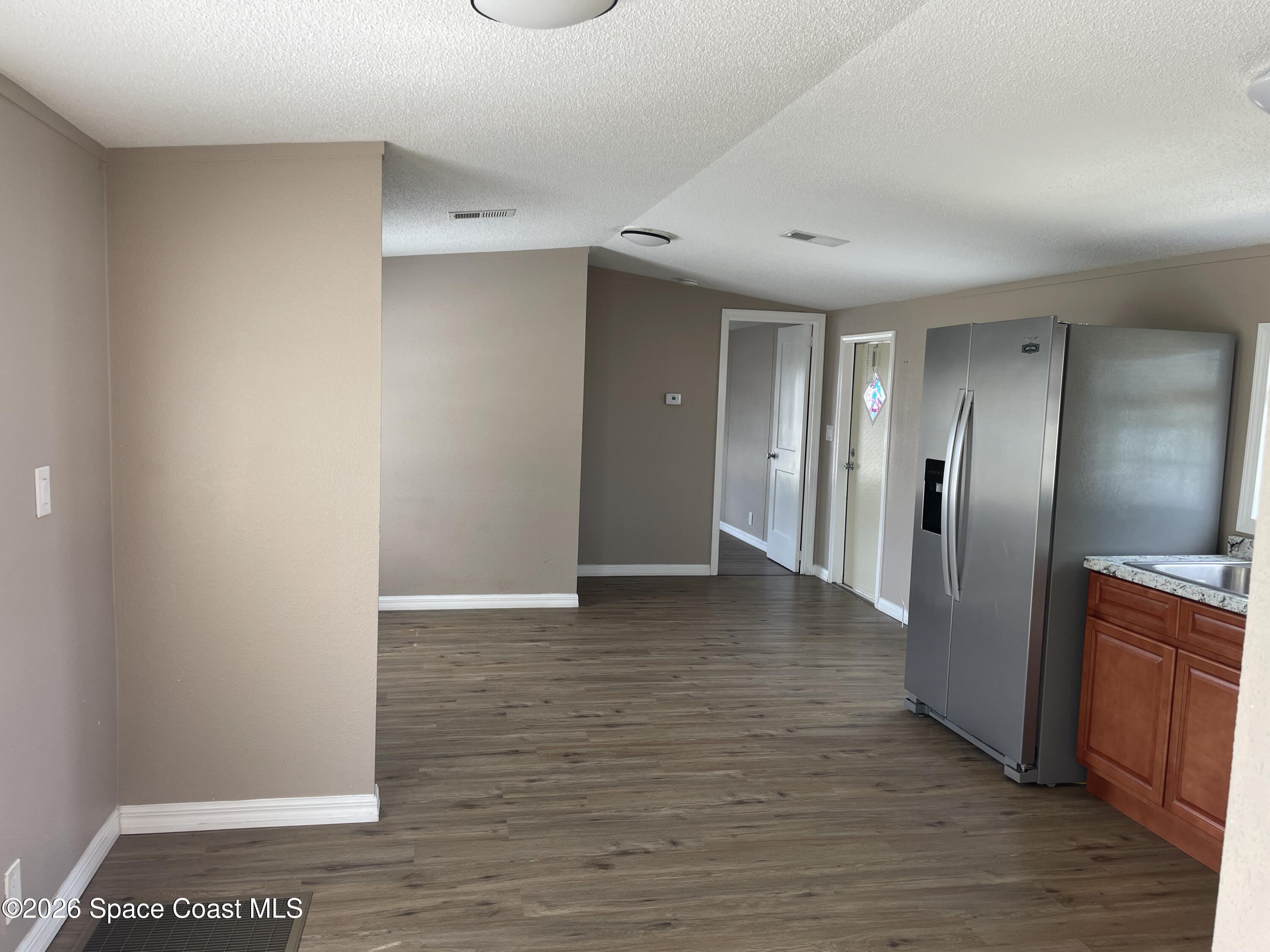 2508 Chatham Way Northeast Palm Bay, FL 32905 - Photo 3 of 14 Kitchen towards living area
