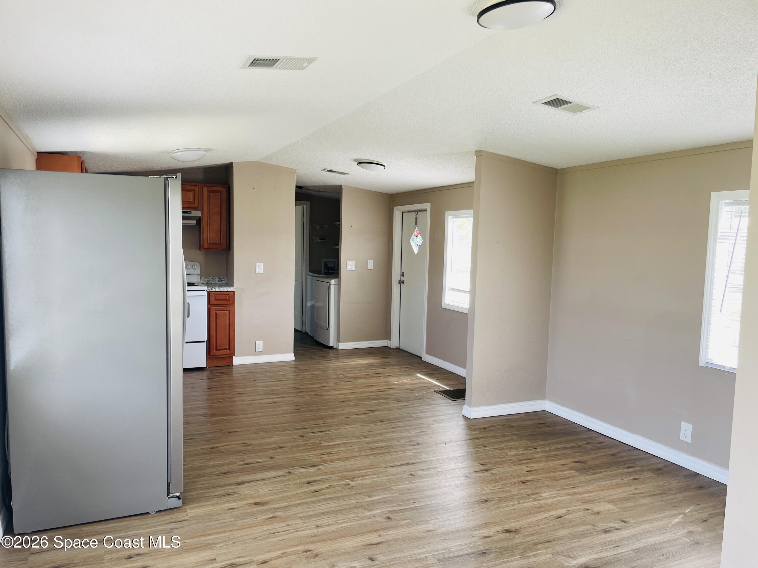 2508 Chatham Way Northeast Palm Bay, FL 32905 - Photo 8 of 14 Master towards kitchen area
