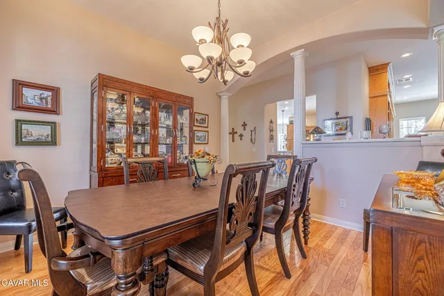 a kitchen with stainless steel appliances granite countertop a refrigerator a oven and a sink