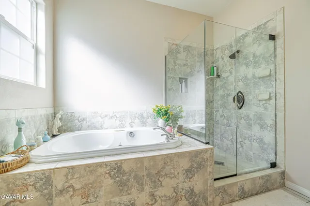 a bedroom with a bed and dresser