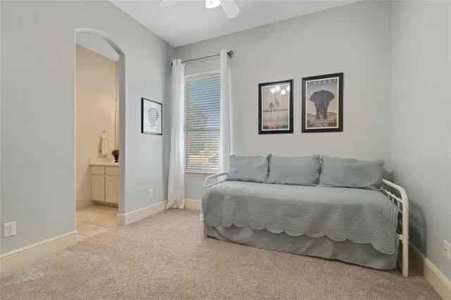 a bedroom with a bed and a painting