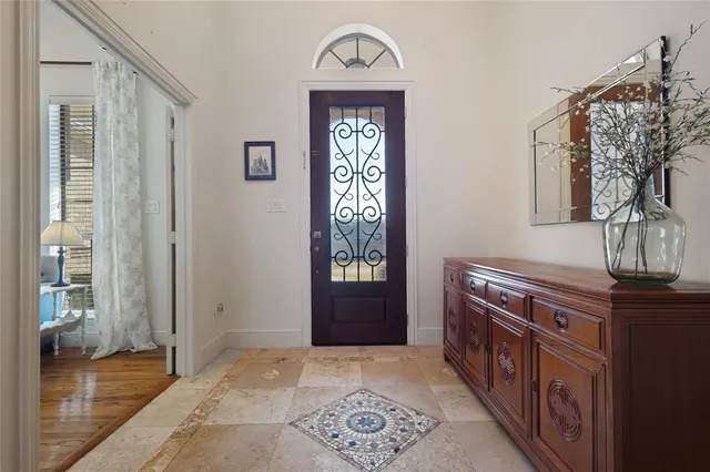 a view of an entryway with wooden floor