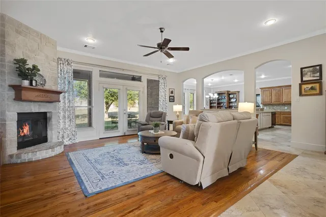 a living room with furniture and a fireplace