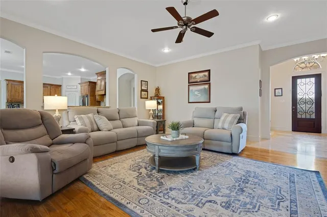 a living room with furniture and a rug