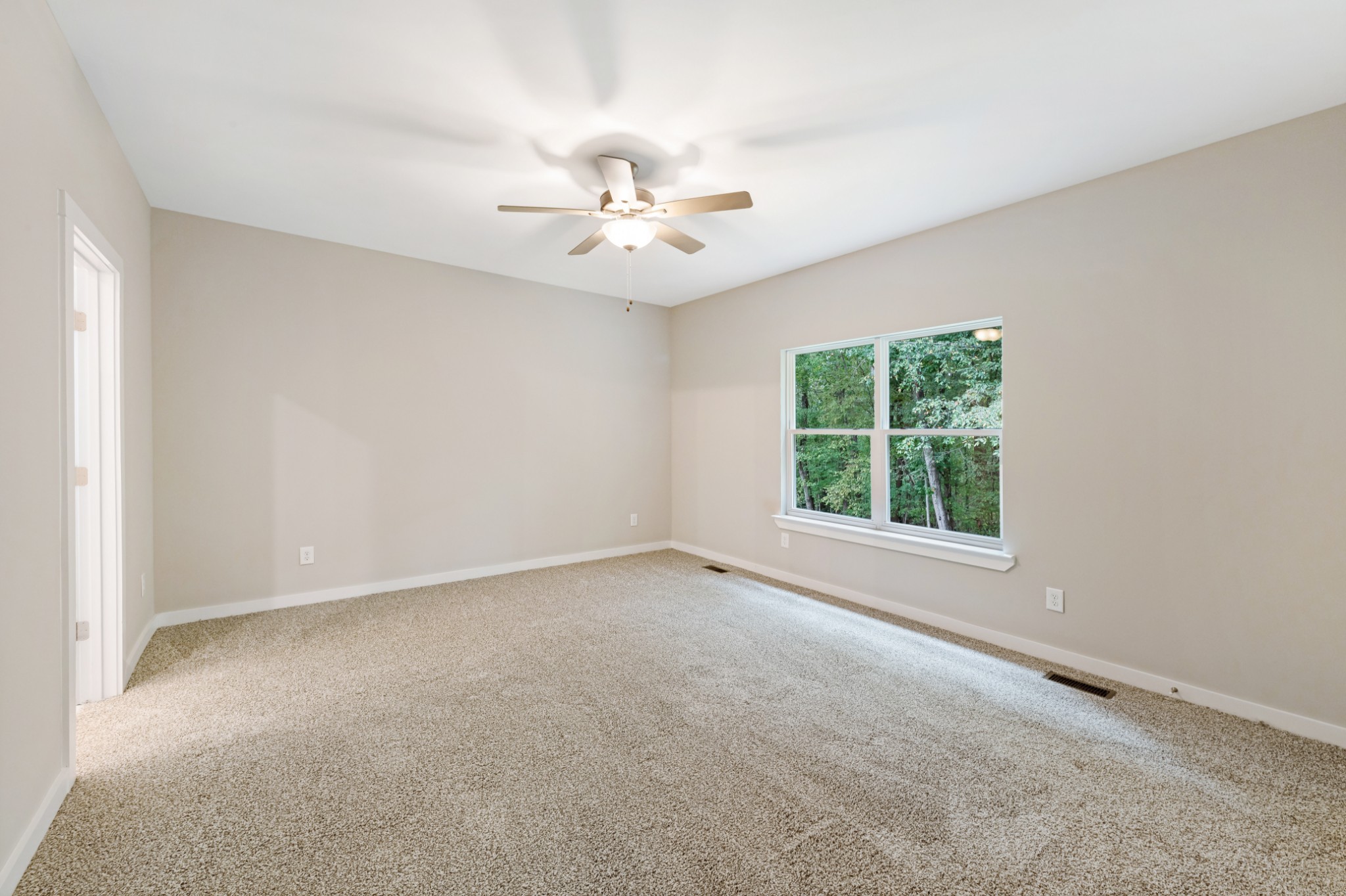 2074 Morgan Court Springfield, TN 37172 - Photo 12 of 20 an empty room with a window and a fan