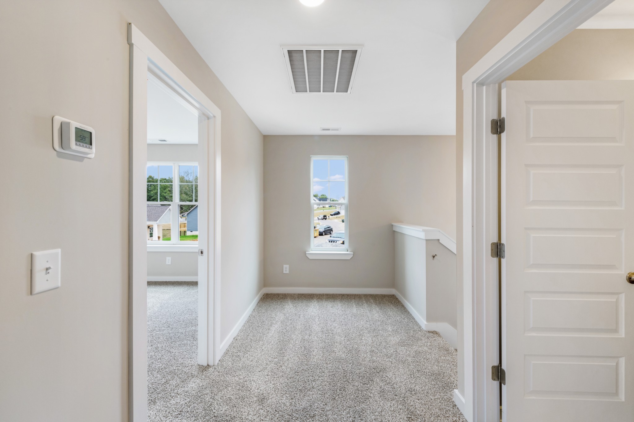 2074 Morgan Court Springfield, TN 37172 - Photo 14 of 20 a view of a hallway with bathroom and wooden floor