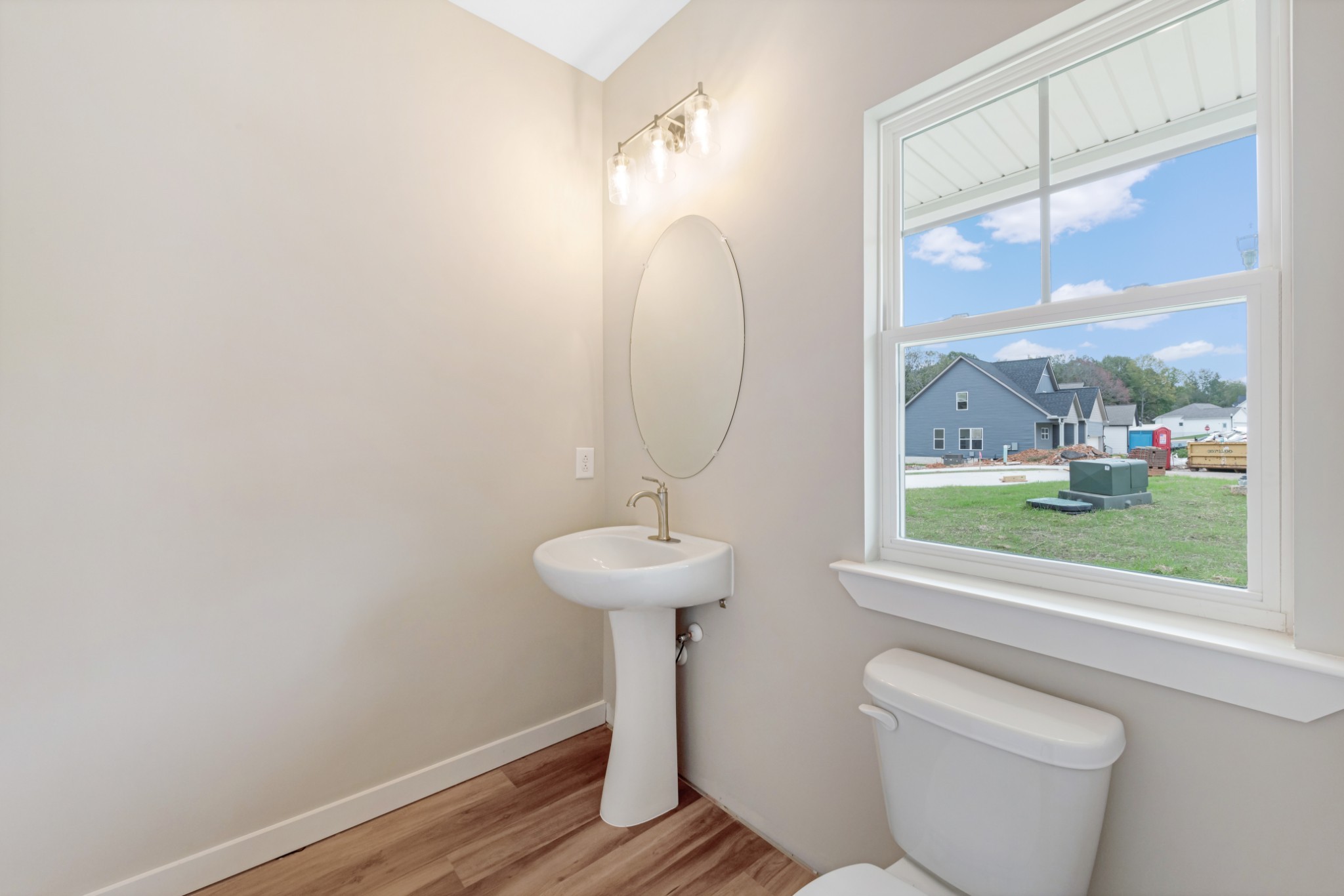 2074 Morgan Court Springfield, TN 37172 - Photo 6 of 20 a bathroom with a toilet a sink and a window
