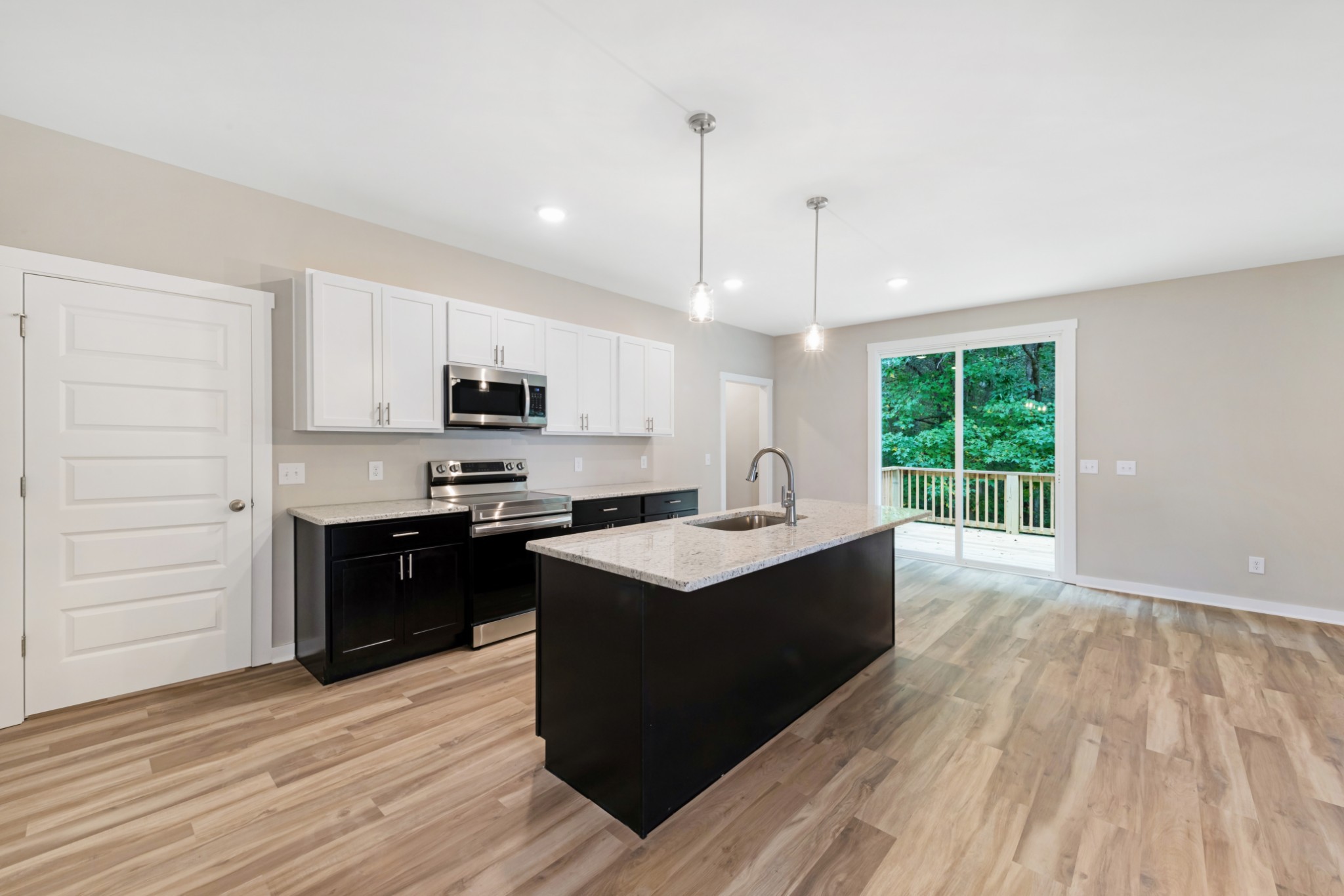 2074 Morgan Court Springfield, TN 37172 - Photo 7 of 20 a kitchen with stainless steel appliances granite countertop a sink stove and refrigerator