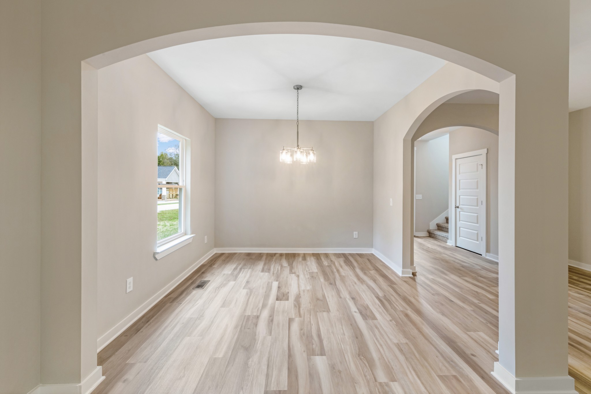 2074 Morgan Court Springfield, TN 37172 - Photo 10 of 20 wooden floor in an empty room with a window