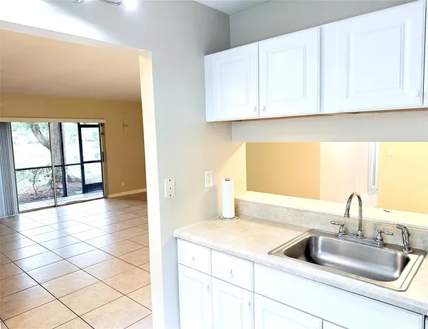 a kitchen with a sink and cabinets
