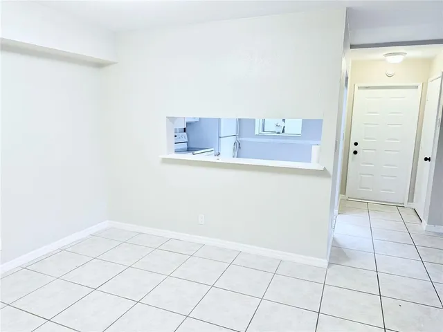 a view of a kitchen with an empty space and a sink