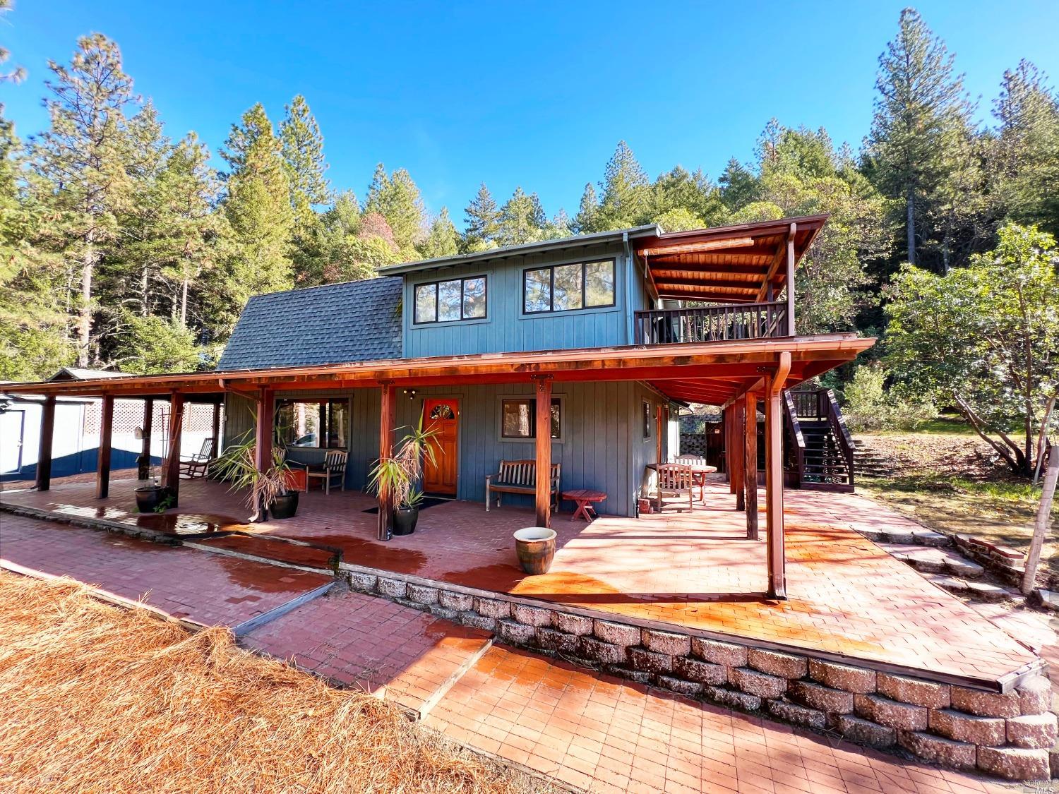 6900 Ridgewood Road Willits, CA 95490 - Photo 1 of 1 a outdoor view of a building with sitting area