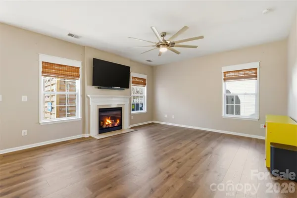 a large kitchen with stainless steel appliances granite countertop a refrigerator and a sink