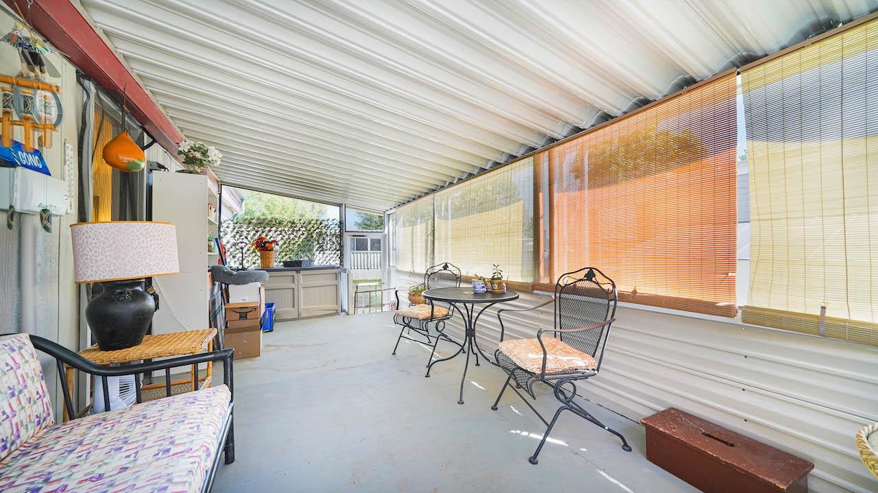 3251 E Road, Unit 100 Clifton, CO 81520 - Photo 18 of 22 a living room with furniture and a large window