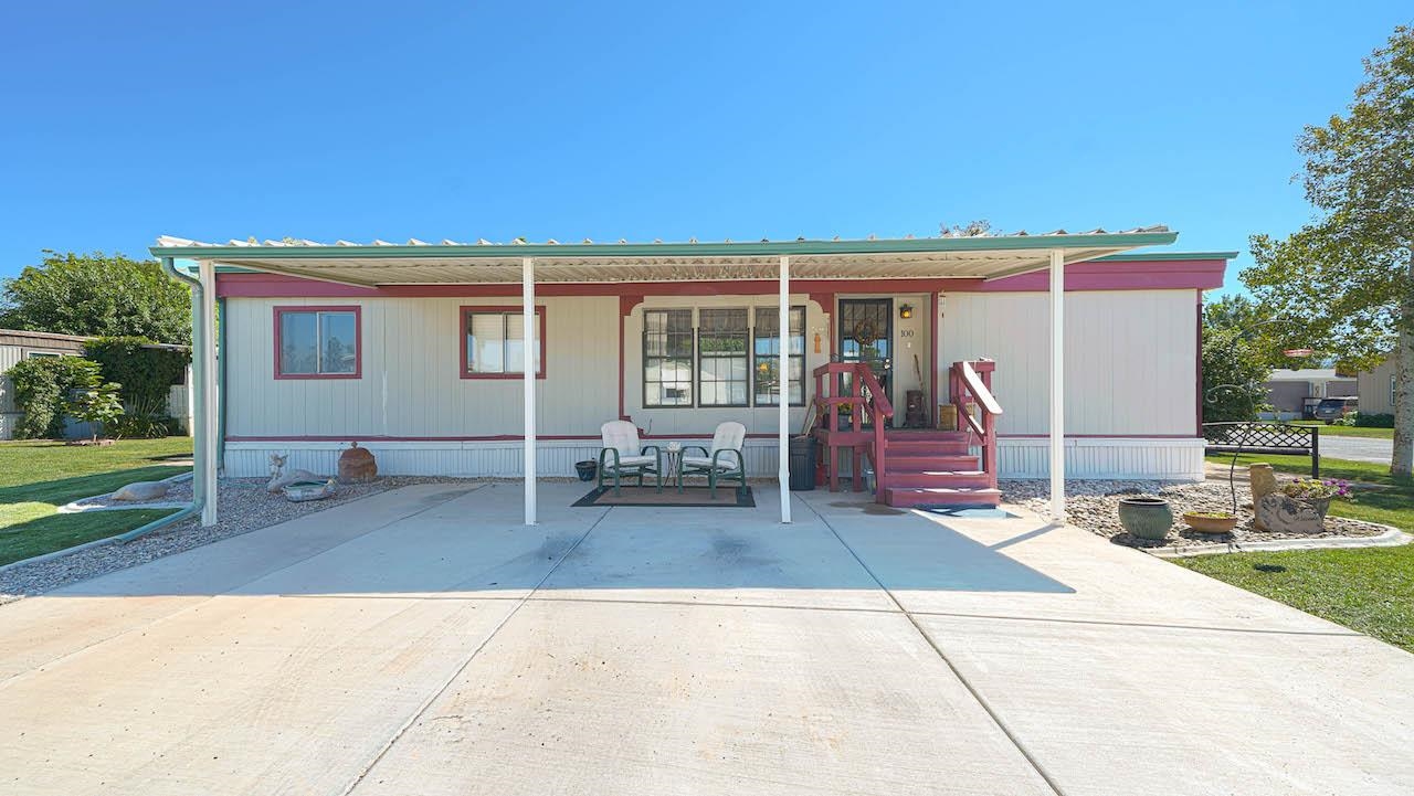 3251 E Road, Unit 100 Clifton, CO 81520 - Photo 20 of 22 a view of a house with backyard and a garden