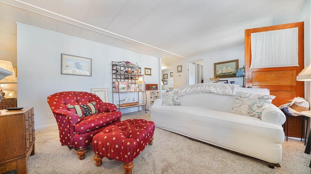 3251 E Road, Unit 100 Clifton, CO 81520 - Photo 3 of 22 a living room with furniture
