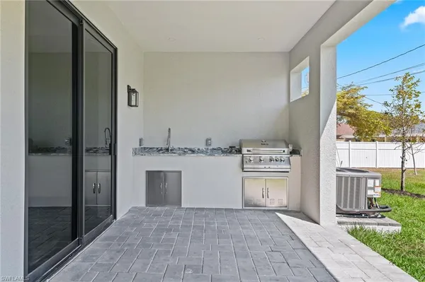 a view of washer and dryer with a kitchen