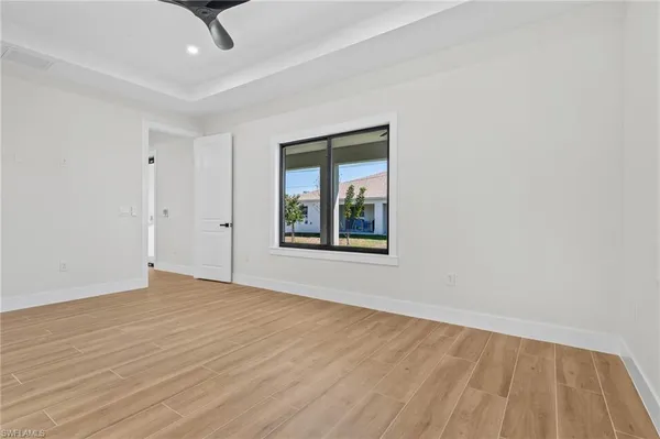 a view of an empty room with a window