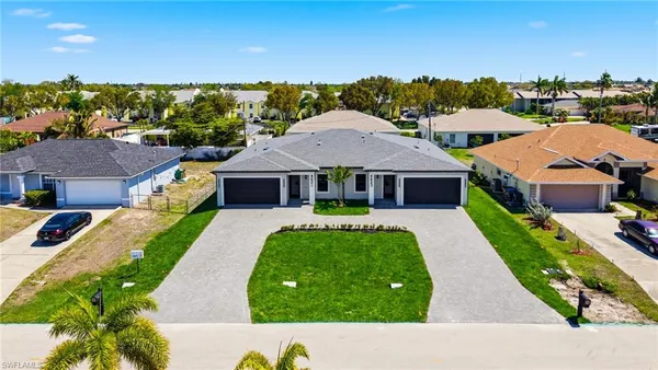 a aerial view of a house with a yard
