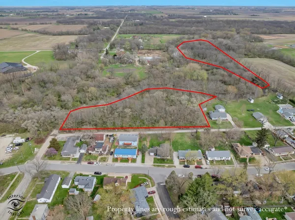 an aerial view of a house with outdoor space