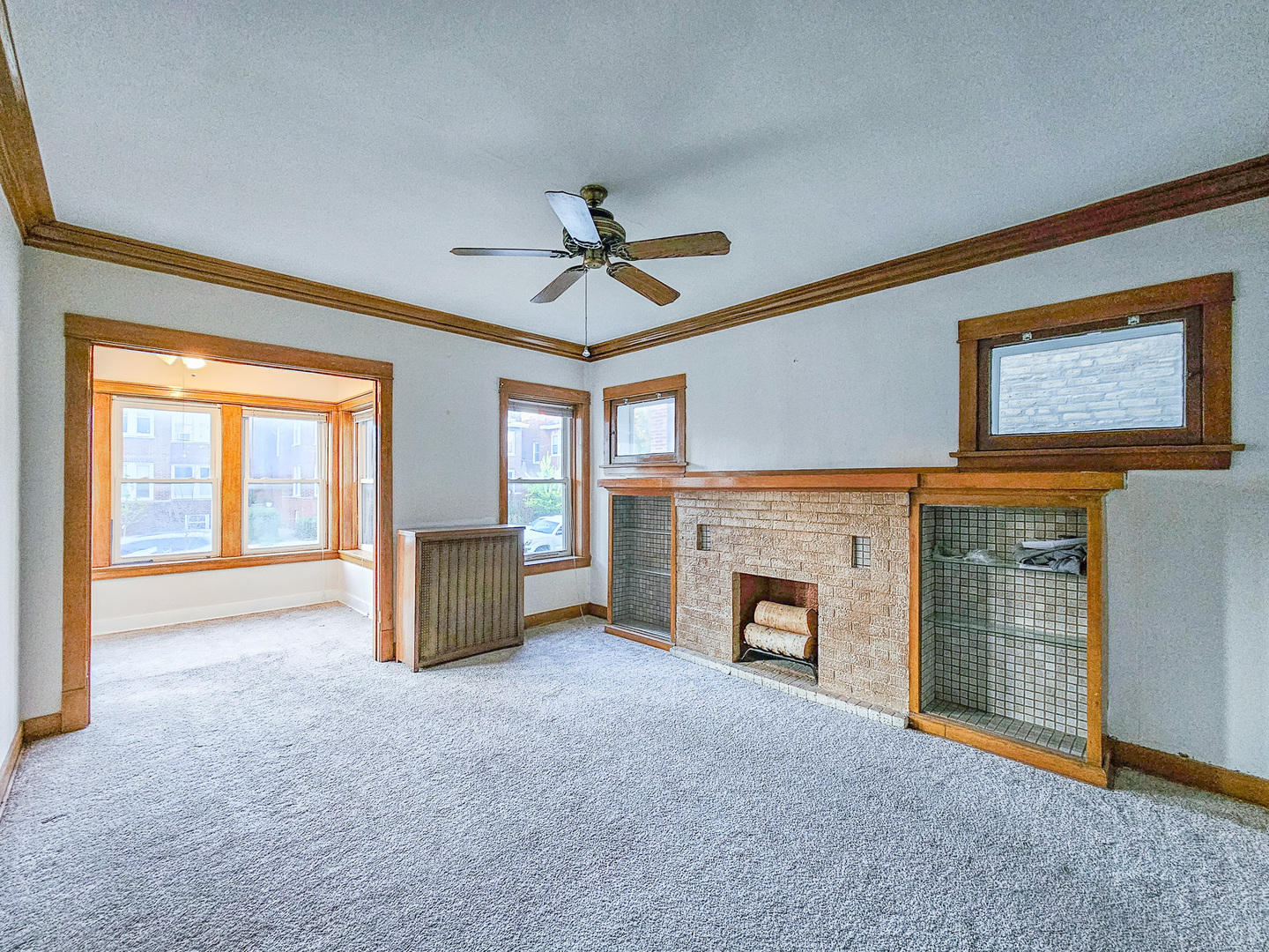 3338 West Cullom Avenue, Unit 1 Chicago, IL 60618 - Photo 2 of 14 a living room with furniture and a fireplace