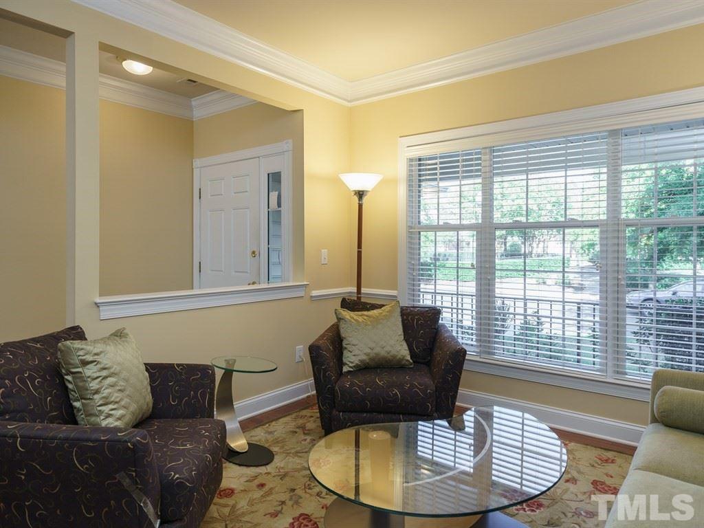 9523 Vira Drive Raleigh, NC 27617 - Photo 2 of 25 a living room with furniture and a large window