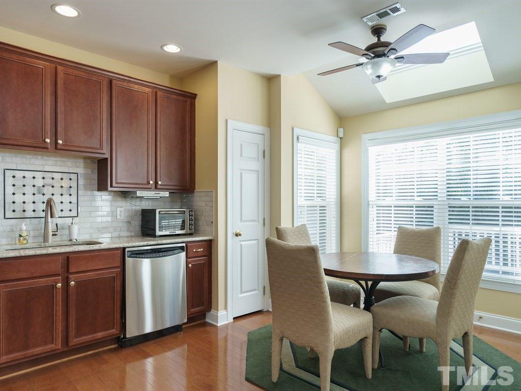 9523 Vira Drive Raleigh, NC 27617 - Photo 13 of 25 a view of a dining room with furniture window and wooden floor