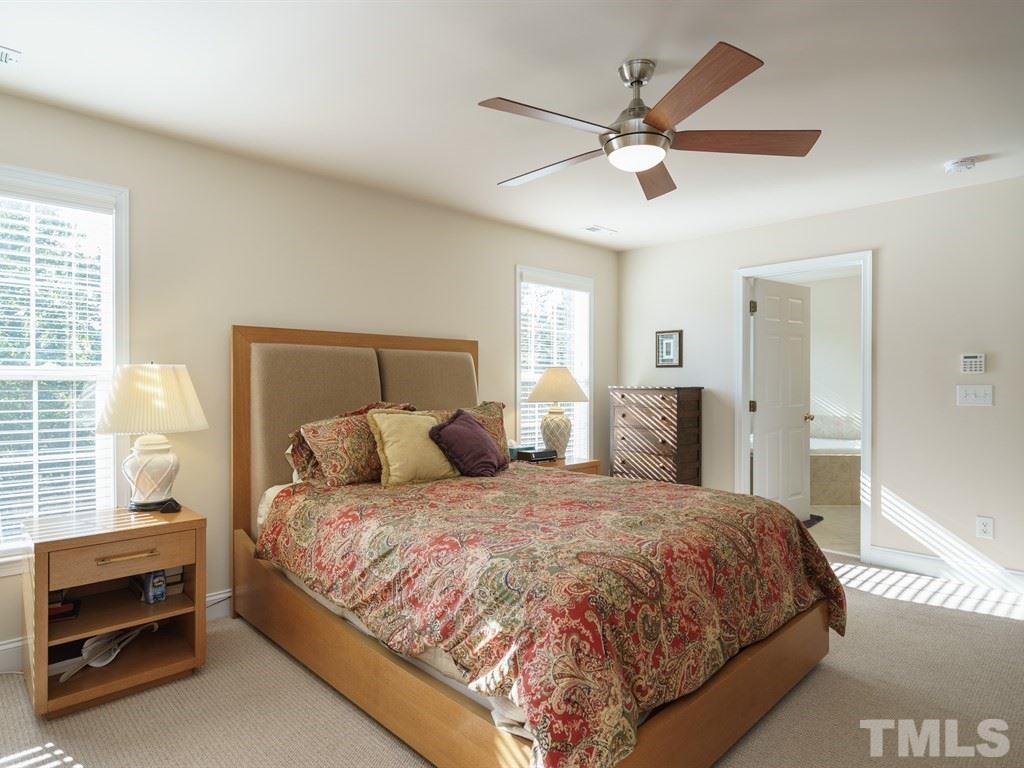 9523 Vira Drive Raleigh, NC 27617 - Photo 15 of 25 a bedroom with a bed and window