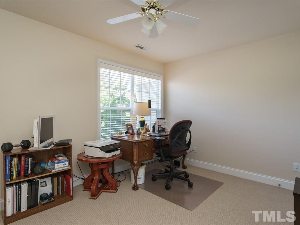 9523 Vira Drive Raleigh, NC 27617 - Photo 19 of 25 a view of a workspace with furniture and a window