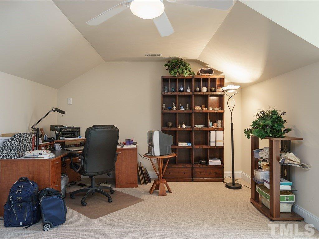 9523 Vira Drive Raleigh, NC 27617 - Photo 20 of 25 a view of a workspace with furniture