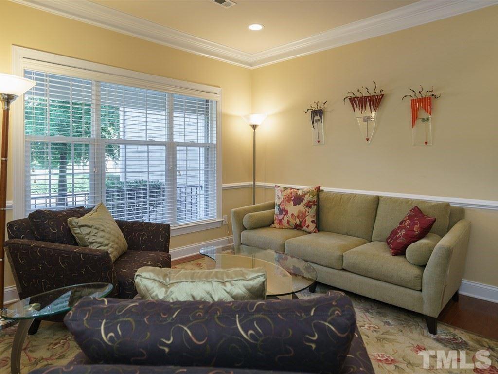 9523 Vira Drive Raleigh, NC 27617 - Photo 3 of 25 a living room with furniture and a large window