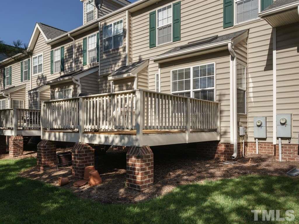 9523 Vira Drive Raleigh, NC 27617 - Photo 22 of 25 a view of a house with a wooden deck