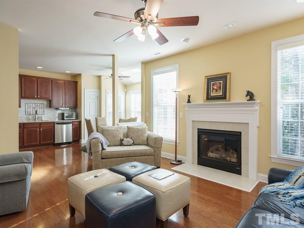 9523 Vira Drive Raleigh, NC 27617 - Photo 8 of 25 a living room with furniture and a fireplace