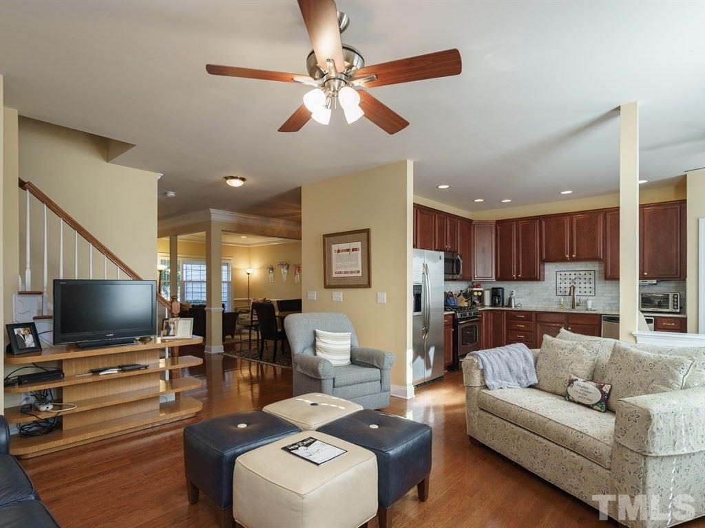 9523 Vira Drive Raleigh, NC 27617 - Photo 9 of 25 a living room with furniture and a flat screen tv