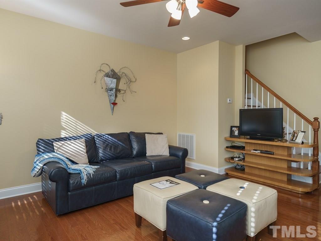 9523 Vira Drive Raleigh, NC 27617 - Photo 10 of 25 a living room with furniture and a flat screen tv